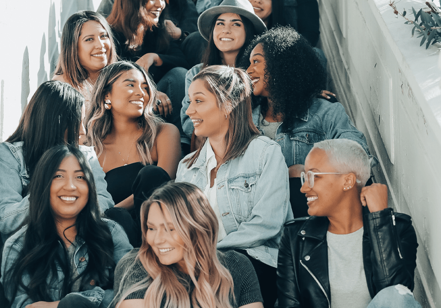 WomenGroup diverse women sitting in stairwell
